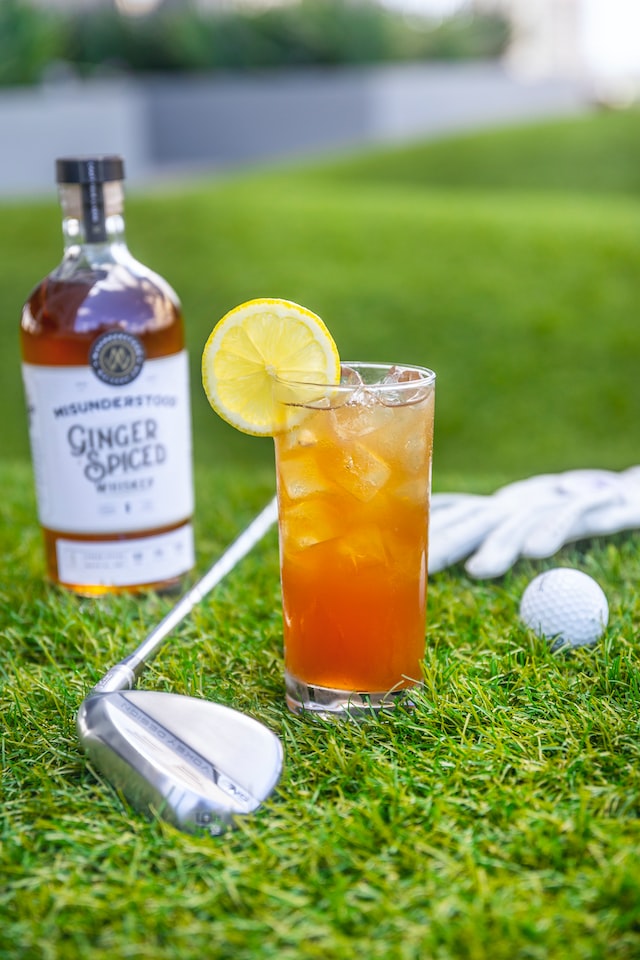 a bottle of rum and golf club