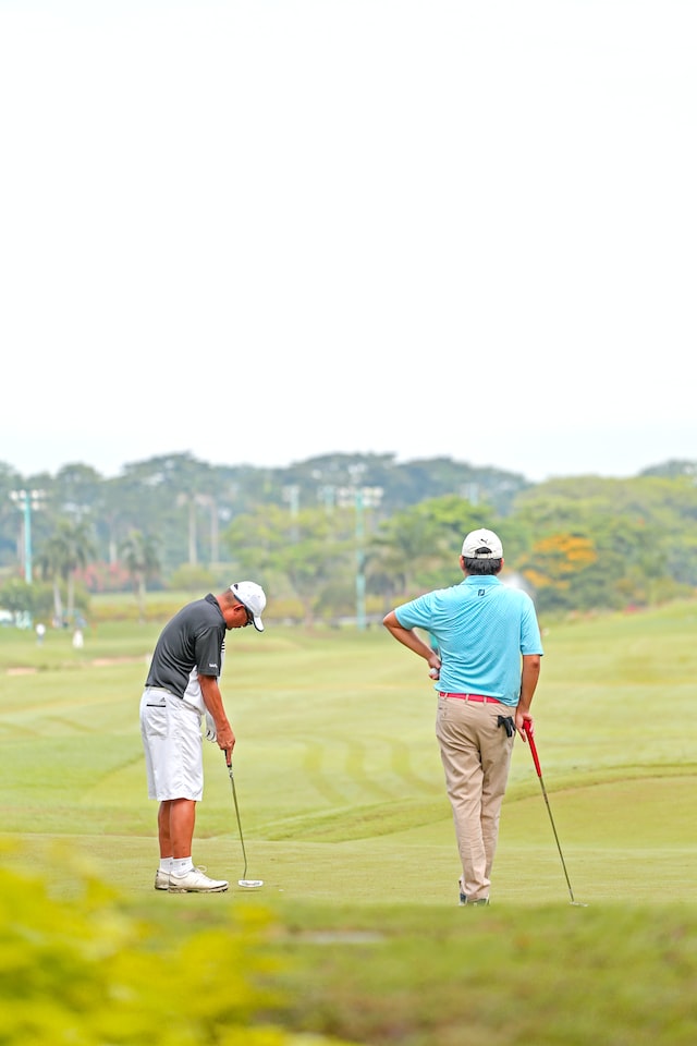 two male golfer on a fairway